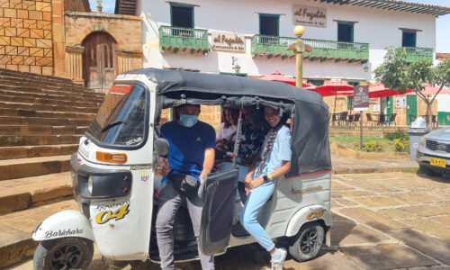 An adventurous auto rickshaw ride through the charming streets of Barichara, Colombia, to explore the area's captivating beauty.