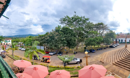 A panoramic photo capturing the lively and fun atmosphere of Barichara, Colombia - a town brimming with excitement and adventure.