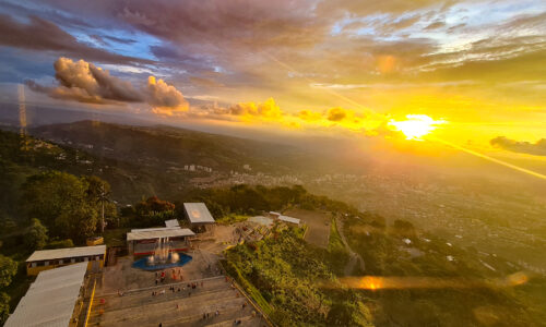 A captivating sunset view from the Jesus statue at Cerro del Santisimo, offering a breathtaking vista as it gazes eastward, invoking a sense of wonder and serenity.