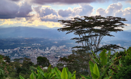 Panoramic view of Bucaramanga from Cerro del Santisimo, showcasing the city's vibrant landscape and bustling streets.