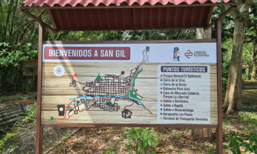 An inviting signboard announcing the vibrant town of San Gil, beckoning travelers with its promise of thrilling adventures, cultural riches, and unforgettable experiences.